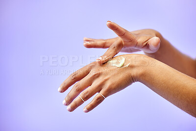 Buy stock photo Hands, dry skin and woman with cream for studio skincare, cosmetics or wellness on purple background. Bodycare, beauty or lady model with lotion, dermatology or eczema, acne or treatment application