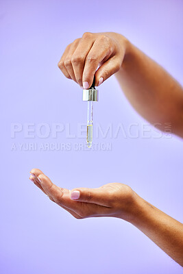 Buy stock photo Skincare, hands and woman with oil in studio for wellness, dermatology or skin glow on purple background. Beauty, female and lady model show liquid serum for self care, shine or cosmetic collagen