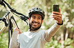 Man, bicycle and forest for selfie, nature or smile for wellness, training or blog on adventure. Influencer guy, cycling and mountain bike for profile picture, memory or live stream on social network