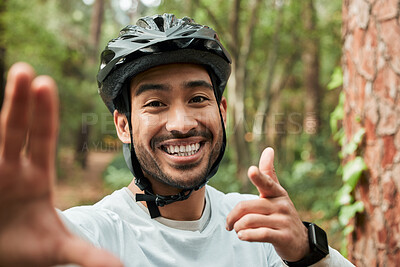 Buy stock photo Cycling man, selfie and smile in forest, pointing and portrait for wellness, training and blog on adventure. Influencer guy, helmet and happy in profile picture, memory or live stream on social media