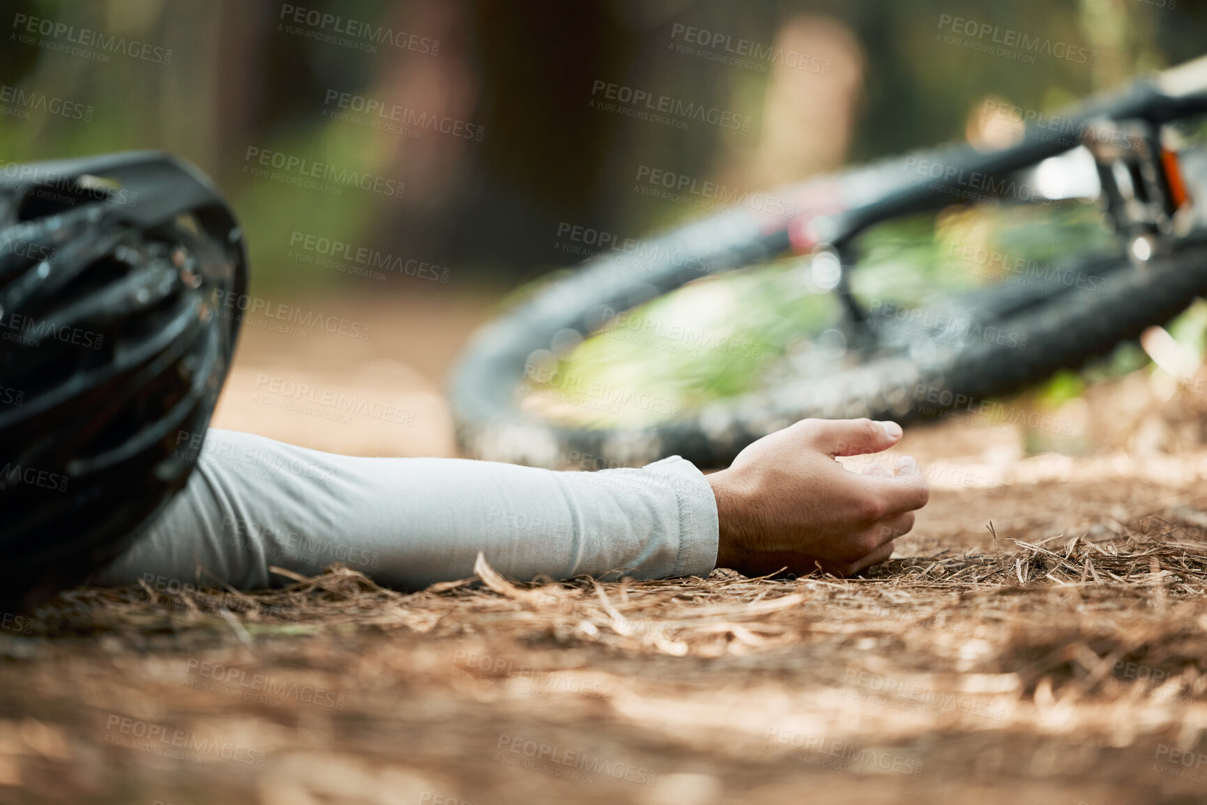 Buy stock photo Man, cycling and fall on forest trail from fitness, workout and training accident on bike lying on ground. Dirt road, woods and emergency of a athlete with injury from sport on a park path outdoor 