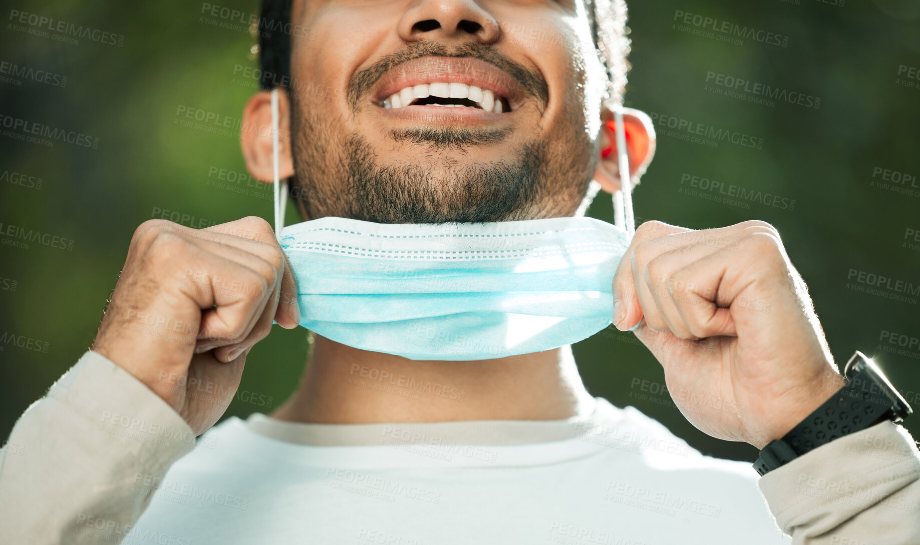 Buy stock photo Mouth, mask and remove with a man breathing fresh air in nature, feeling happy at the end of restrictions. Covid, freedom and post lockdown with a person closeup in the forest, woods or wilderness