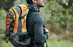 Man, backpack and closeup with view, thinking and camping travel in the forest for holiday. Exercise, trekking workout and hiking in the woods for vacation with freedom in nature on a journey