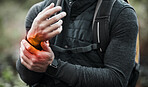 Wrist, pain and hands of man in sports, outdoor and hiking with a medical accident, crisis or problem with anatomy in red glow. Training, injury and athlete or trauma to muscle, joint or hand