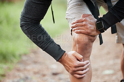 Buy stock photo Knee pain, injury and person hand in park with fitness, workout and training accident from hike. Runner, leg massage and fail from trekking in the woods on a trail with muscle strain and emergency 