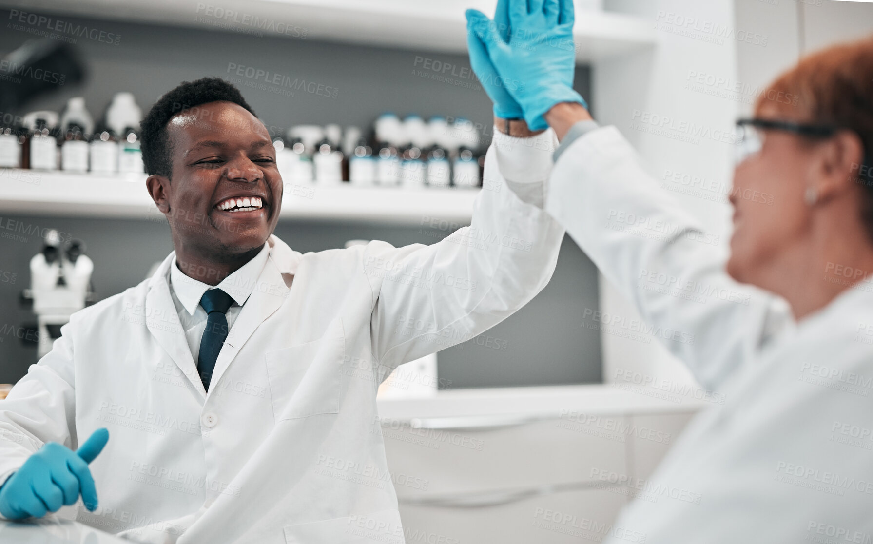 Buy stock photo Scientist teamwork, man and woman with high five, laboratory and smile for partnership goals with results. African science expert, yes and congratulations for success, medical research and innovation