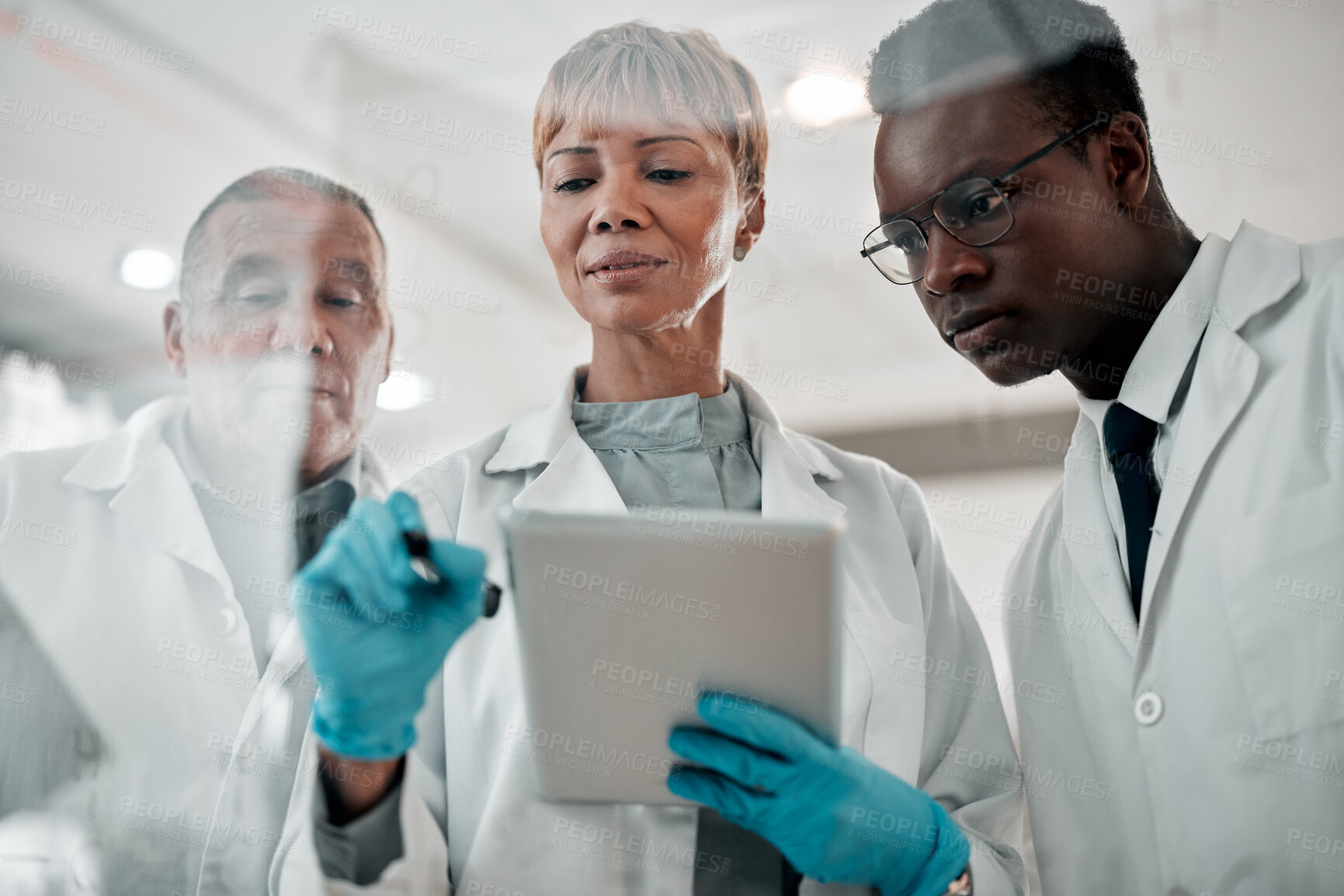 Buy stock photo Doctors, tablet and woman writing and planning ideas on glass board in hospital for collaboration. Medical staff, diversity or team with tech for healthcare strategy, brainstorming or science meeting