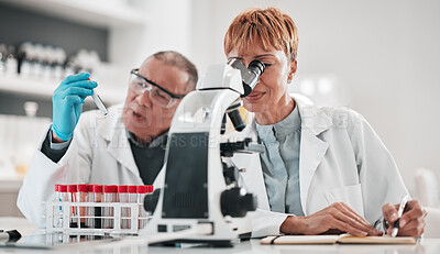 Buy stock photo Science, team and microscope for test in laboratory, medical investigation or healthcare innovation. Man, woman and biotechnology analysis for vaccine development, chemistry research and review notes