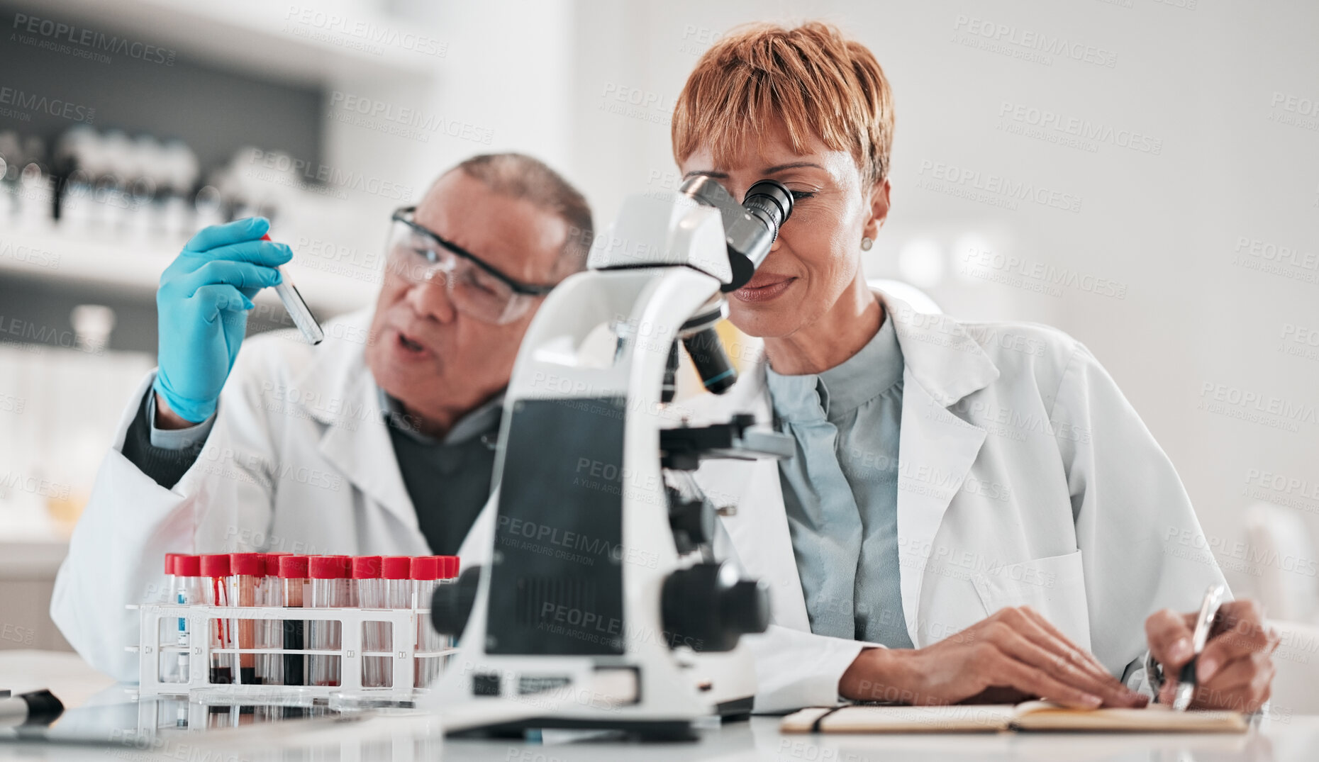 Buy stock photo Science, team and microscope for test in laboratory, medical investigation or healthcare innovation. Man, woman and biotechnology analysis for vaccine development, chemistry research and review notes