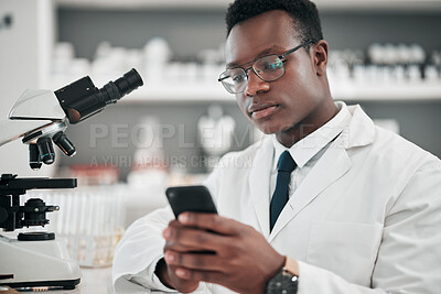 Buy stock photo Medical science, man and a phone in a laboratory for online communication, email or website. African scientist person with smartphone typing for medicine research, social media or network database