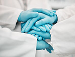 Ppe, doctor and nurse hands together for teamwork, solidarity and collaboration in hospital with gloves. Medical workers, professional people and support for healthcare, motivation and community