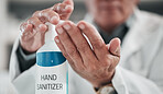 Doctor, hands and press sanitizer bottle for cleaning, risk or protocol of hygiene in hospital, clinic and surgery. Closeup, healthcare and disinfection liquid for safety, flu germs or virus bacteria