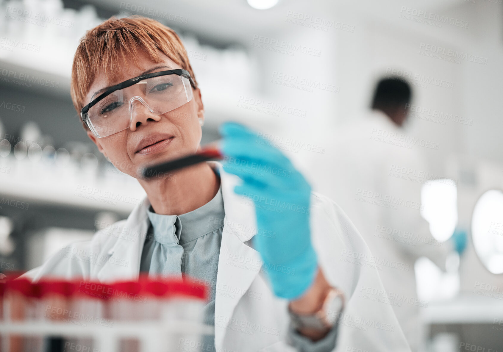 Buy stock photo Woman, scientist and blood sample in lab, ideas and analysis with ppe glasses, safety and test. Science, pathology and expert with thinking, inspection and dna data for medical research in laboratory