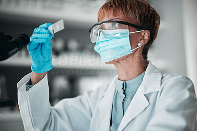 Buy stock photo Microscope slide, woman and research with healthcare, mask and particles with biotechnology, review sample and dna. Person, medical or scientist with face cover, laboratory equipment or data analysis