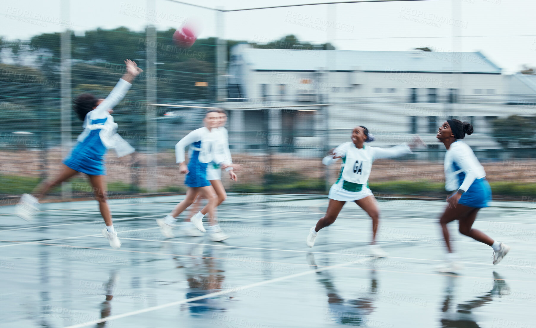 Buy stock photo Sports, netball team player and women running, cardio or challenge for ball, competition and play active game. Motion blur, outdoor tournament and group workout, exercise and player training together