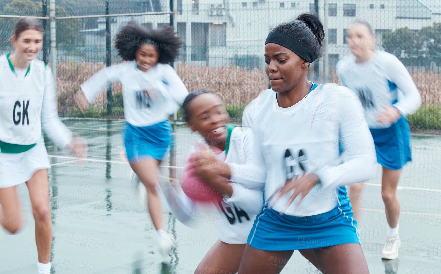 Buy stock photo Netball , sports and team with game and women for defend in competition, match or group practice. Motion blur, action and player workout, exercise and athlete training, teamwork fitness on court