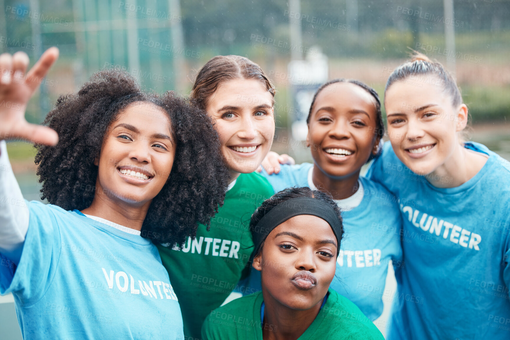 Buy stock photo Volunteer, woman and portrait for charity and community support on netball field with diversity and smile. Happiness, people and teamwork for ngo project, solidarity and mission outdoor in nature