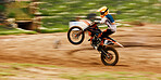 Motorcycle, balance and motion blur with a man at a race on space in the forest for dirt biking. Bike, fitness and power with a sports person driving fast on an off road course for freedom or speed