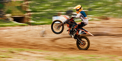 Buy stock photo Motorcycle, balance and motion blur with a man at a race on space in the forest for dirt biking. Bike, fitness and power with a sports person driving fast on an off road course for freedom or speed