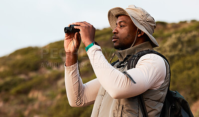 Buy stock photo Hiking, binocular or black man on mountain in nature on trekking journey or adventure for freedom. View, holiday vacation or African hiker walking to search in park for exercise, fitness or wellness