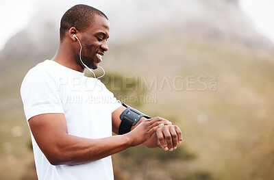 Buy stock photo Fitness, watch and music with a black man hiking in the forest for health, wellness or cardio on space. Exercise, time and smile with a happy young athlete in the mountains or nature for running