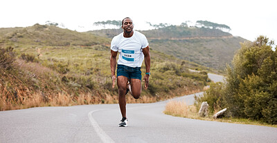 Fitness, running and and man in a road for marathon, sports and training, morning or cardio routine. Runner, workout and African male athlete in street with energy, exercise or resilience performance