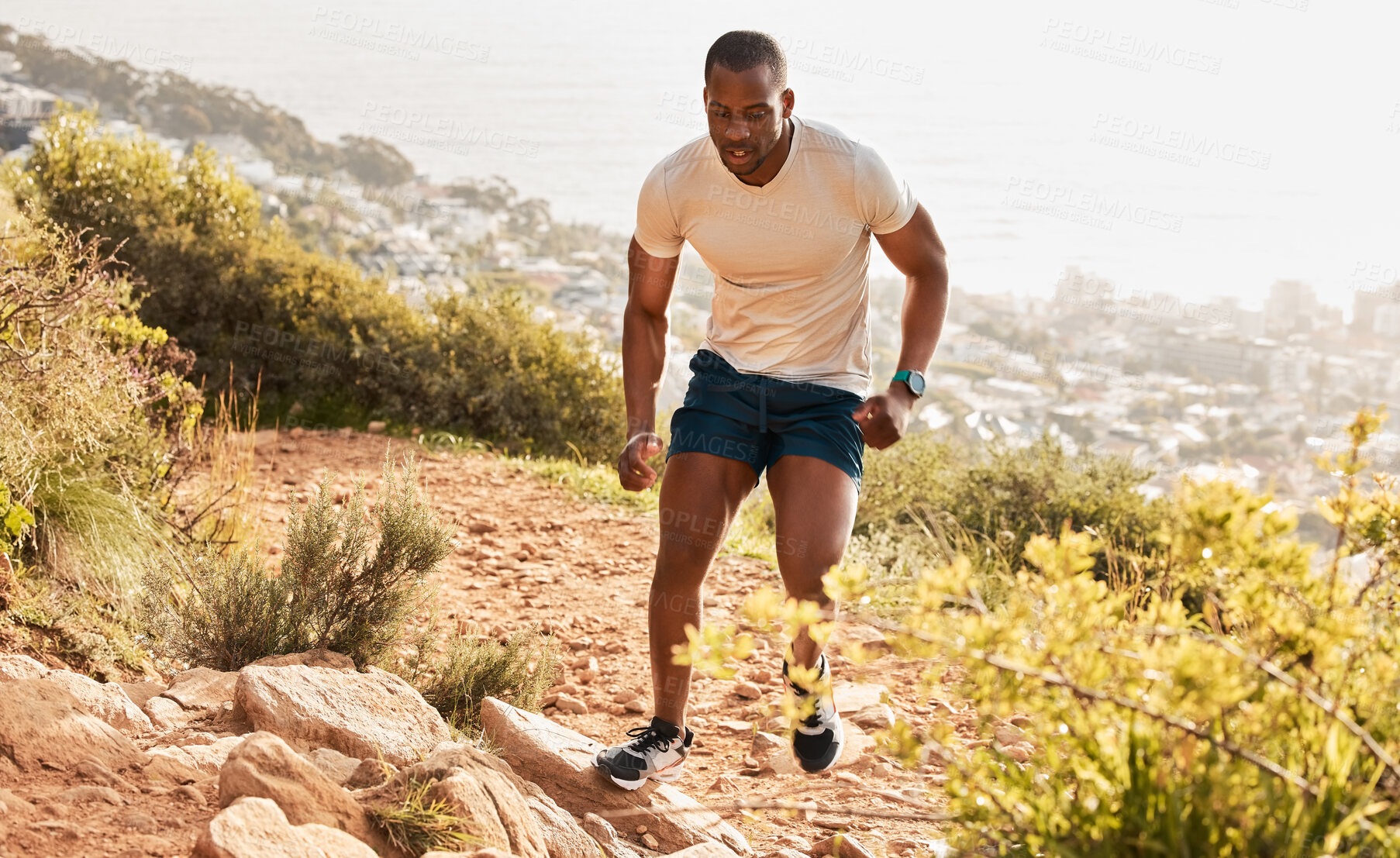 Buy stock photo Fitness, trail or runner running on mountain by nature for exercise, training or outdoor workout. Sports race, fast black man or healthy active athlete on hill with endurance, freedom or challenge