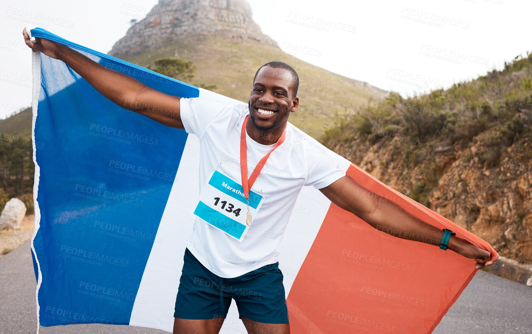 Buy stock photo Runner man, flag and winner with smile, pride and celebration for marathon, fitness and sports for France. Black guy, athlete and fabric for national sign, success or achievement at race in Cape Town