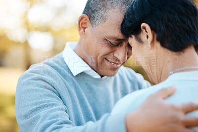 Buy stock photo Happy, connection and senior couple hugging in a park on an outdoor date for romance, bonding or love. Smile, happiness and elderly man and woman in retirement in nature in field together at sunset.