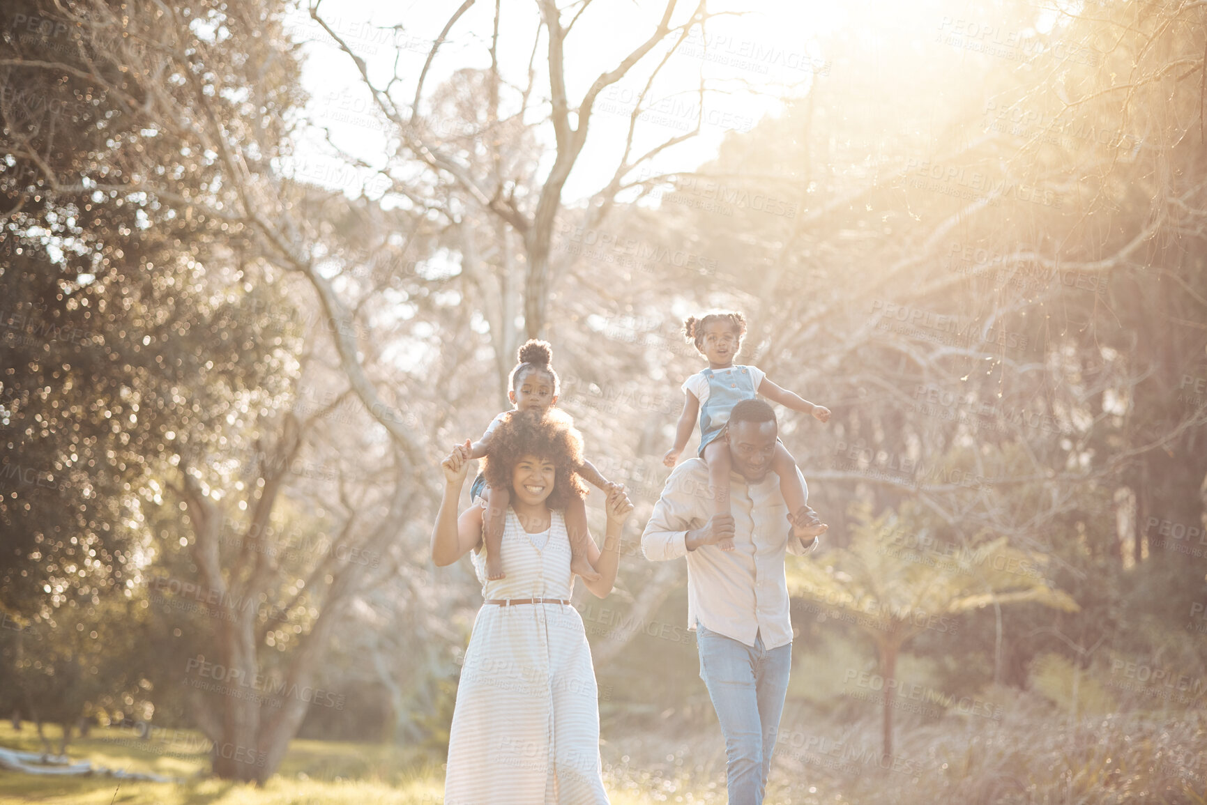 Buy stock photo Parents with children in woods, piggy back and walking for love, bonding or peace in nature together. Mother, father and kids on shoulders in garden, black family on summer weekend in park or forrest