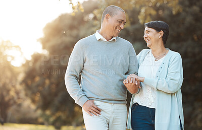 Buy stock photo Mature couple, love and walking in garden for happy date, holiday and relax in retirement. Man, woman and holding hands with smile in park, nature and support of freedom, trust and loyalty to partner