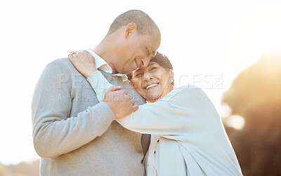 Buy stock photo Laugh, love and senior couple in a park on an outdoor date for romance, bonding or happiness. Smile, nature and elderly man and woman in retirement hugging and walking in a field together at sunset.