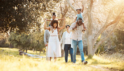 Buy stock photo Big family, happy and walking at park together, care and bonding outdoor. Grandparents, kids and interracial mother and father in nature on holiday, travel vacation in garden and having fun at forest