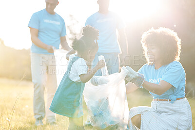 Buy stock photo Nature activist, volunteering family and child cleaning garbage pollution, trash litter and throw bottle in plastic bag. Group teamwork, waste management and mother helping kid with clean up project