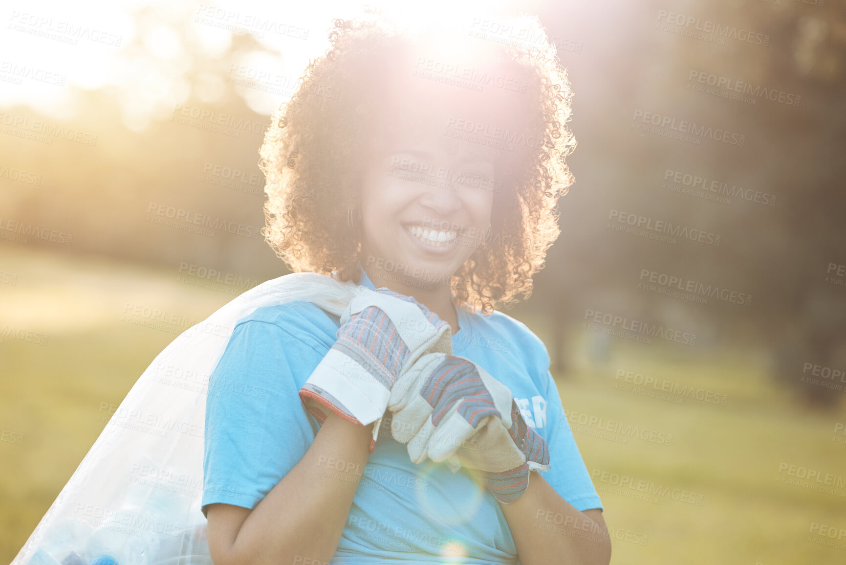 Buy stock photo Nature portrait, community volunteer and happy woman cleaning garbage, eco waste and plastic trash. Sunshine, NGO service and activist support park clean up, outreach project or environment pollution