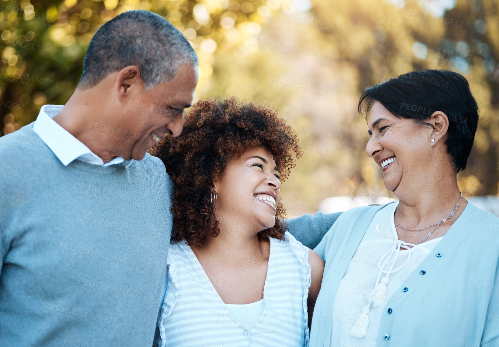 Buy stock photo Happy, smile and woman with senior parents in an outdoor park for adventure, holiday or weekend trip. Love, bonding and young female person in conversation with her elderly mom and dad from Mexico.