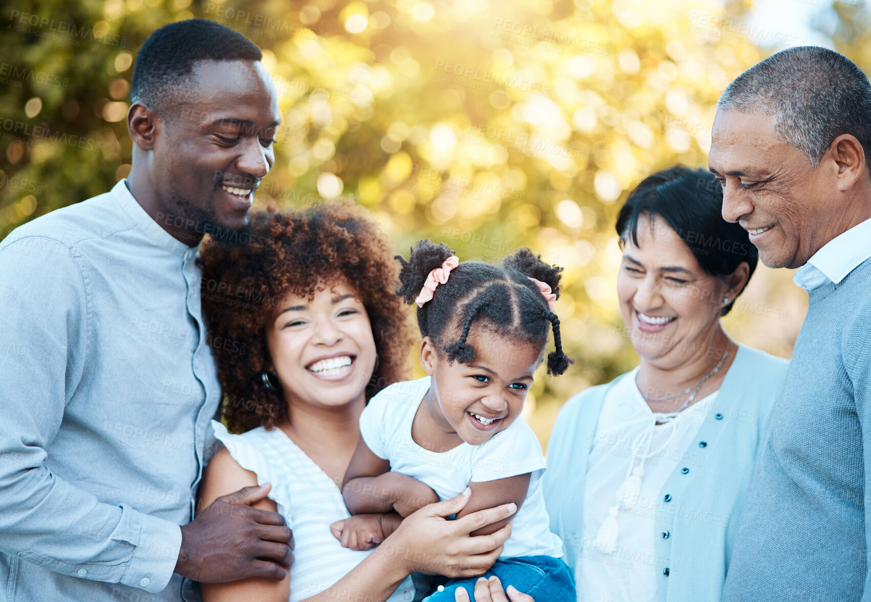 Buy stock photo Happy, love and family generations in nature at an outdoor park together for bonding. Smile, fun and girl child with grandparents and parents in a green garden on weekend trip, adventure or holiday.