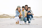 Happy family, portrait and children with parents on beach, vacation or travel to Rio de Janeiro with happiness or freedom. Face, smile and young kids with mom and dad in summer, holiday or nature 