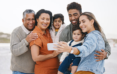 Buy stock photo Family, grandparents and children in selfie on beach for holiday, vacation and outdoor on social media. Happy mother, father and senior people with interracial kids in profile picture or photography