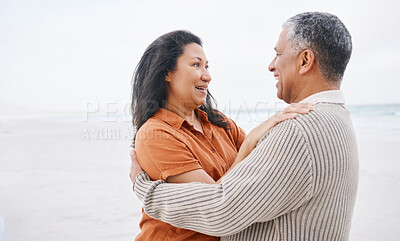 Buy stock photo Beach, hug and senior happy couple love, support and care on travel holiday, retirement vacation and smile in outdoor nature. Eye contact, wellness and elderly man, old woman or marriage people bond