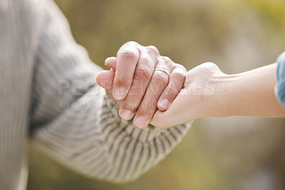 Buy stock photo Couple, holding hands and people with trust in nature, garden or backyard with support, care or love for partner. Solidarity, together or help with respect in partnership, marriage or commitment