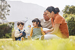 Happy family, grandparents and children for picnic, relax and bubbles on grass or garden outdoor in summer. Love, people and kids in backyard of home for care, freedom and bonding in nature or park