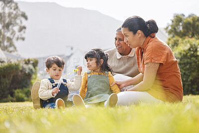 Buy stock photo Happy family, grandparents and children for picnic, relax and bubbles on grass or garden outdoor in summer. Love, people and kids in backyard of home for care, freedom and bonding in nature or park