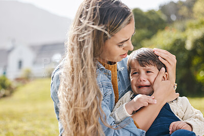 Buy stock photo Sad, console and a crying boy with his mother outdoor in the garden for care, support or empathy. Family, children and love with a woman comforting her son through grief, loss or pain after accident