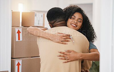 Buy stock photo Happy couple, hug and real estate in new home, moving in or boxes for investment or ownership together. Man and woman with keys in embrace for property, relocation or renovation in house mortgage