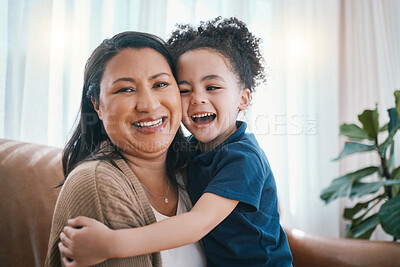 Buy stock photo Family, mother and child hug on sofa in living room for love, happiness and relax at home on a weekend. Play, woman and kid on couch in lounge of apartment together with smile, joy and laughter