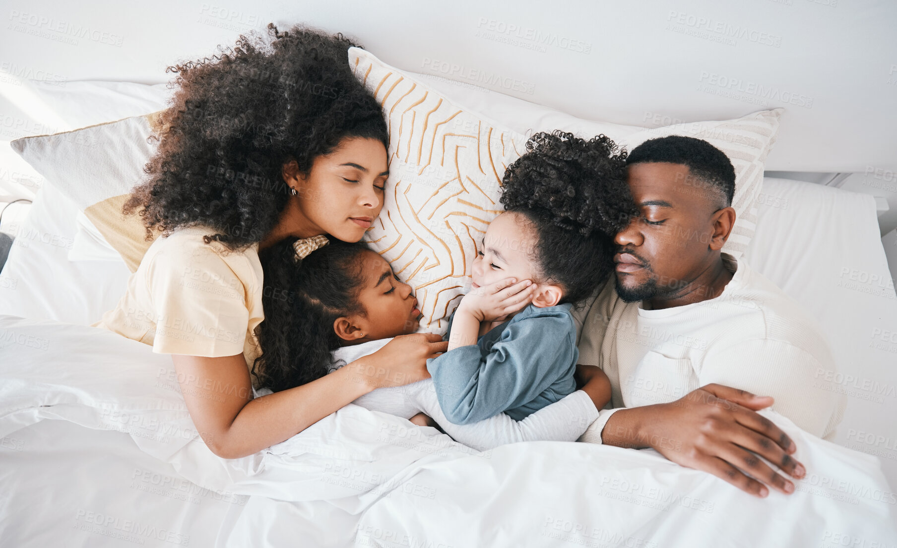 Buy stock photo Mom, dad and kids in bed, sleeping and top view for care, hug and relax together on holiday in family home. Mother, father and tired children for bonding, love or rest in bedroom for fatigue in house