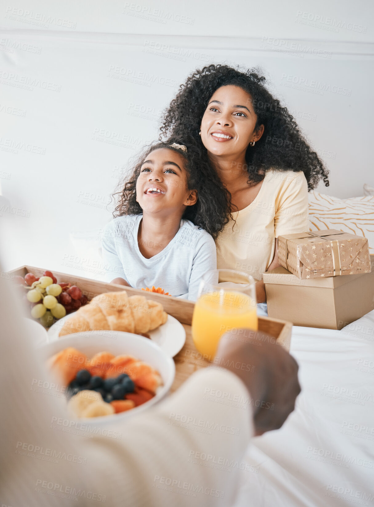 Buy stock photo Hands, mothers day and breakfast in bed, home and happy woman with girl, gift box and kindness for love. Mom, child and person with food, brunch and present in bedroom for bonding in family house