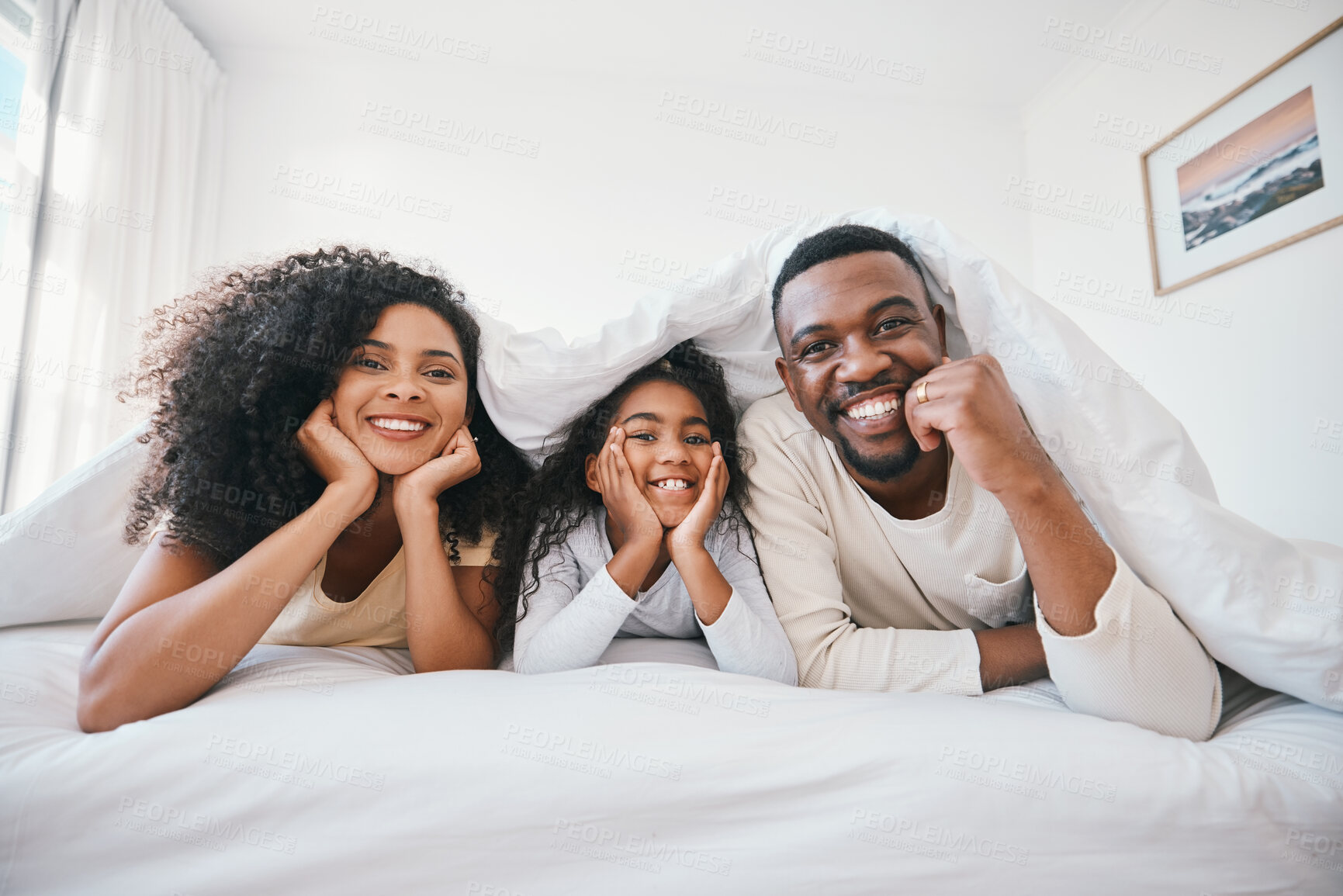 Buy stock photo Family, portrait and relax in bedroom, happiness and love with bonding at home, parents with girl kid in the morning. Smile, support and care with people in bed, blanket and comfort with relationship