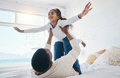 Buy stock photo Airplane, love and father with girl child on a bed for bond, trust or support in their home together. Flying, family time and parent with kid in a bedroom for games, play or fun with weekend freedom